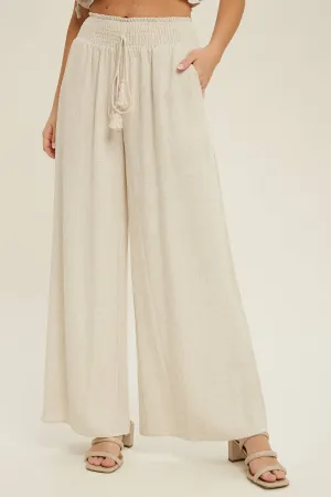 COTTON LINEN SMOCKED WAIST PANTS WITH TASSEL