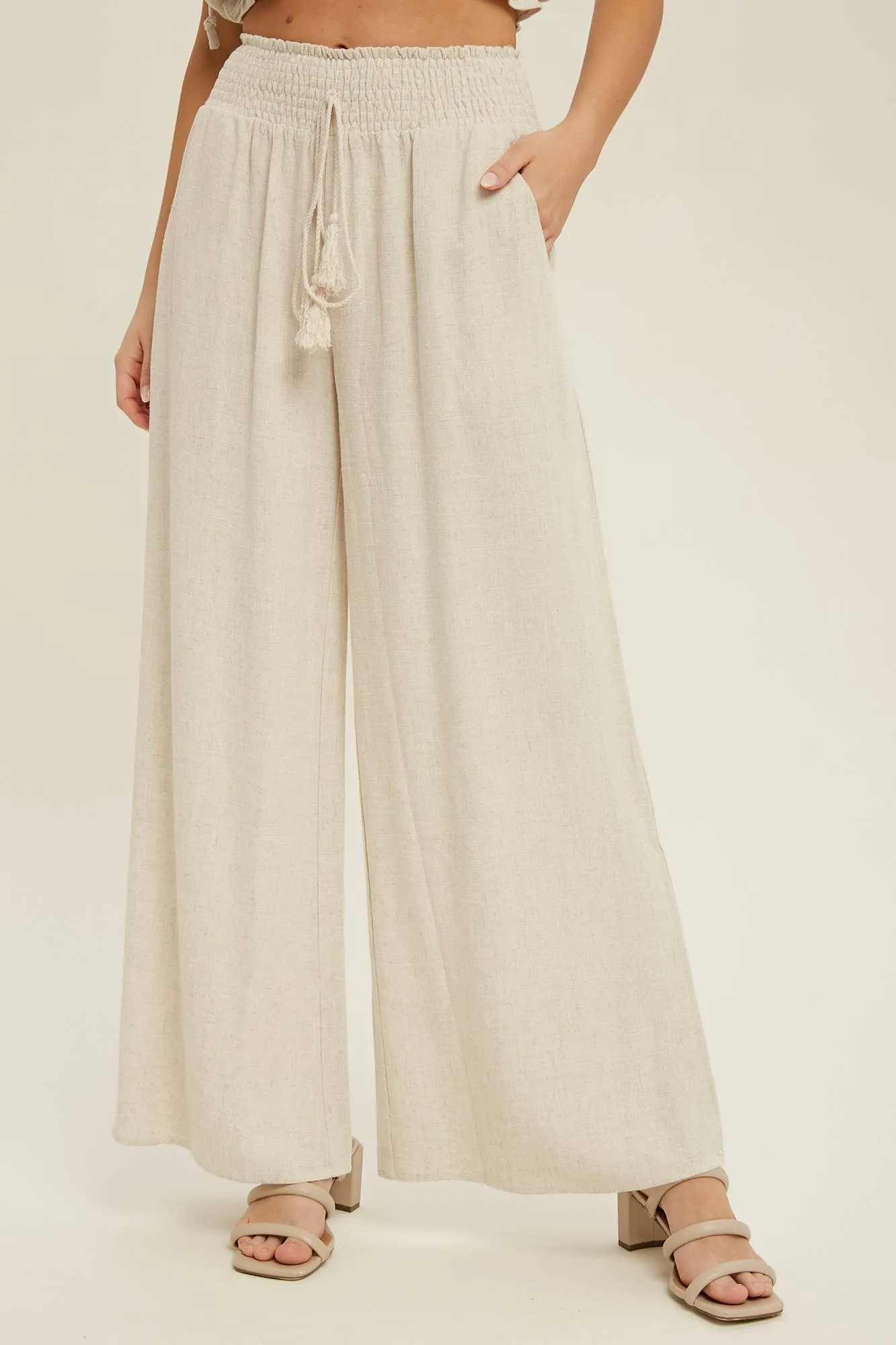 COTTON LINEN SMOCKED WAIST PANTS WITH TASSEL
